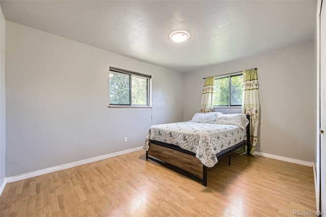 661 S Paris St, Aurora, CO 80012 - bedroom featuring light wood-style floors