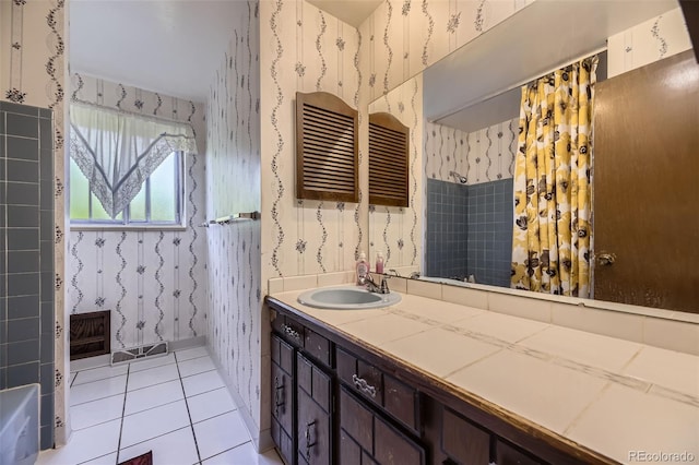 661 S Paris St, Aurora, CO 80012 - bathroom with wallpapered walls, vanity, a shower, and tile patterned floors