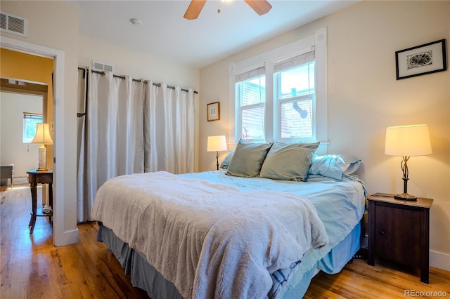 433 Fox St, Denver, CO 80204 - bedroom featuring wood finished floors, baseboards, and a ceiling fan