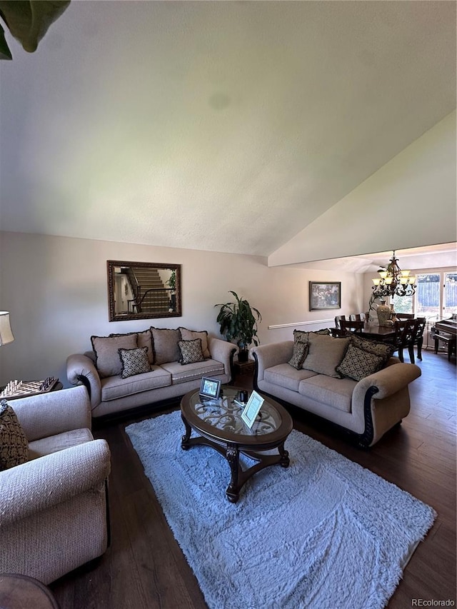 7844 W Friend Dr, Littleton, CO 80128 - living room featuring a chandelier, wood finished floors, and lofted ceiling