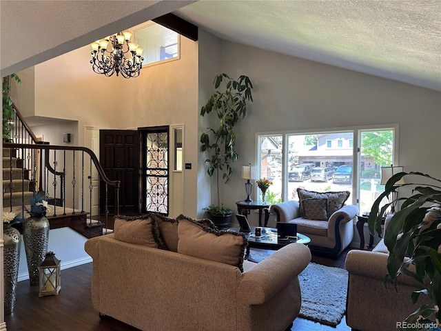 7844 W Friend Dr, Littleton, CO 80128 - living area featuring a chandelier, dark wood-style floors, stairway, high vaulted ceiling, and a textured ceiling