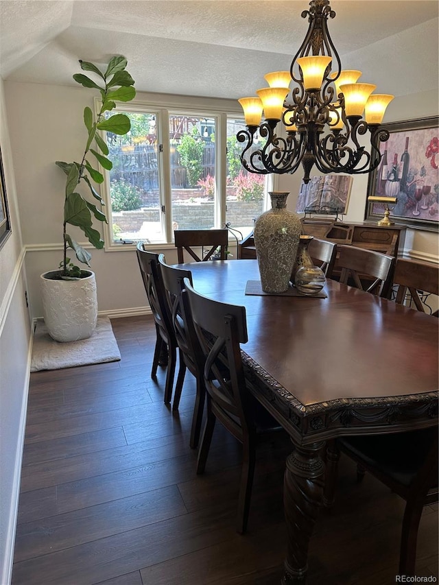 7844 W Friend Dr, Littleton, CO 80128 - dining space featuring a chandelier, dark wood-style floors, and a textured ceiling