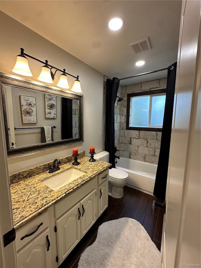 7844 W Friend Dr, Littleton, CO 80128 - bathroom featuring vanity, shower / bathtub combination with curtain, and wood finished floors
