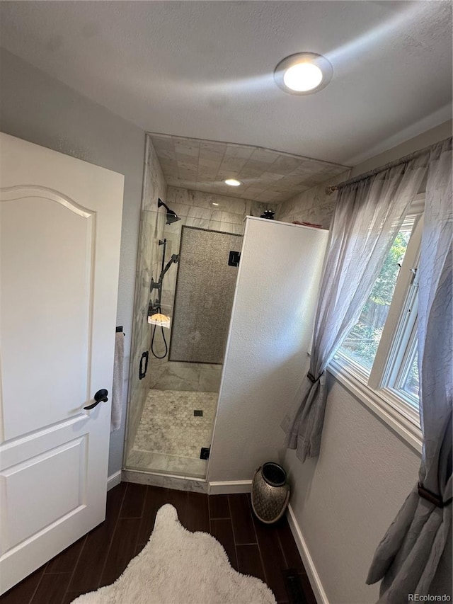 7844 W Friend Dr, Littleton, CO 80128 - bathroom with wood finish floors and a stall shower