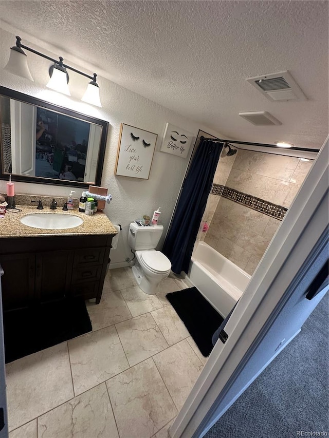 7844 W Friend Dr, Littleton, CO 80128 - full bathroom with a textured ceiling, vanity, shower / bathtub combination with curtain, marble look tiles, and a textured wall