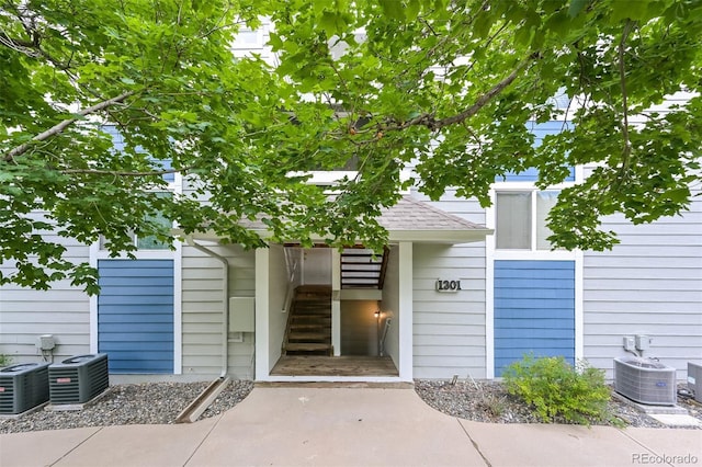 1301 S Cathay Ct Unit 104, Aurora, CO 80017 - doorway to property featuring central AC unit