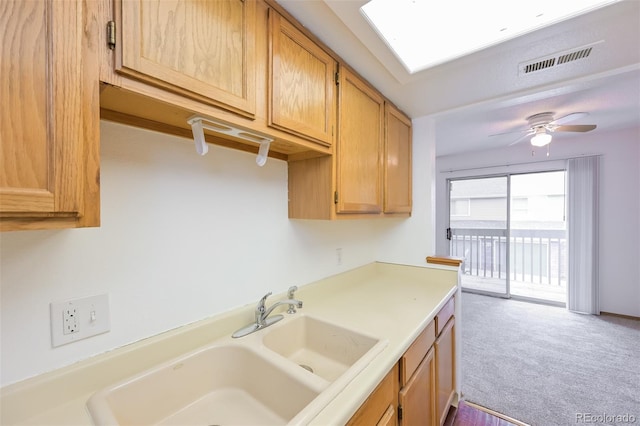 1301 S Cathay Ct Unit 104, Aurora, CO 80017 - kitchen featuring a sink, carpet flooring, light countertops, and ceiling fan