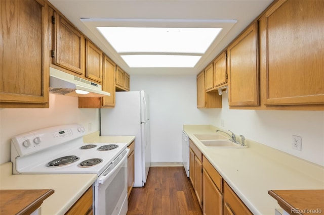 1301 S Cathay Ct Unit 104, Aurora, CO 80017 - kitchen featuring white appliances, under cabinet range hood, a sink, light countertops, and dark wood finished floors