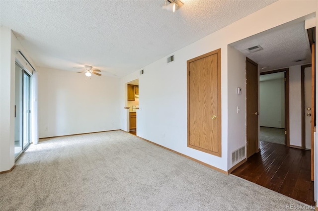 1301 S Cathay Ct Unit 104, Aurora, CO 80017 - carpeted empty room featuring ceiling fan, a textured ceiling, and baseboards