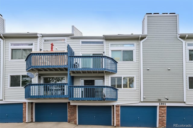 1301 S Cathay Ct Unit 104, Aurora, CO 80017 - view of building exterior featuring a garage