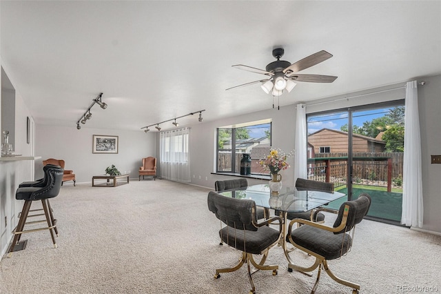 7644 Wyandot St, Denver, CO 80221 - carpeted dining space featuring rail lighting and a ceiling fan
