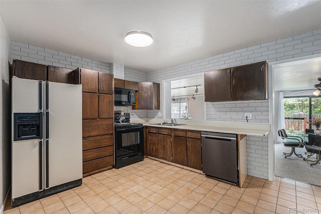 7644 Wyandot St, Denver, CO 80221 - kitchen featuring black appliances, light countertops, dark brown cabinetry, and ceiling fan