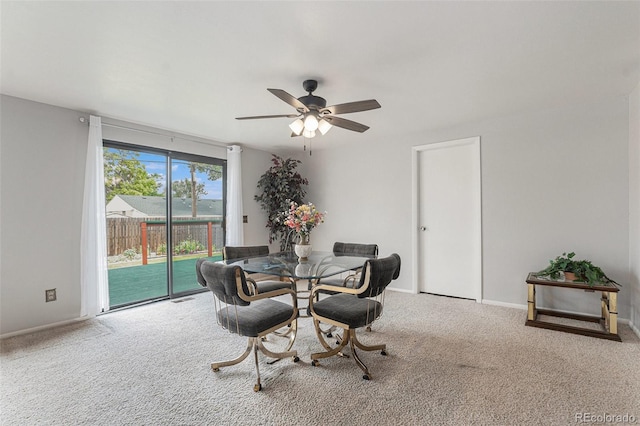 7644 Wyandot St, Denver, CO 80221 - dining room with ceiling fan and carpet flooring