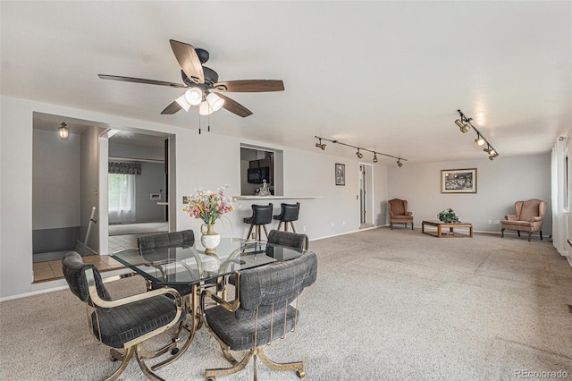 7644 Wyandot St, Denver, CO 80221 - dining area with track lighting, ceiling fan, and carpet floors