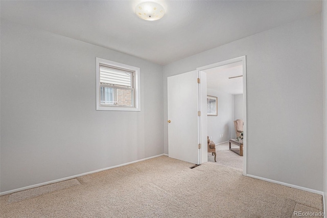 7644 Wyandot St, Denver, CO 80221 - spare room featuring carpet and baseboards