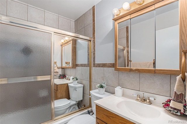 7644 Wyandot St, Denver, CO 80221 - full bath featuring vanity, a shower with door, and tile walls