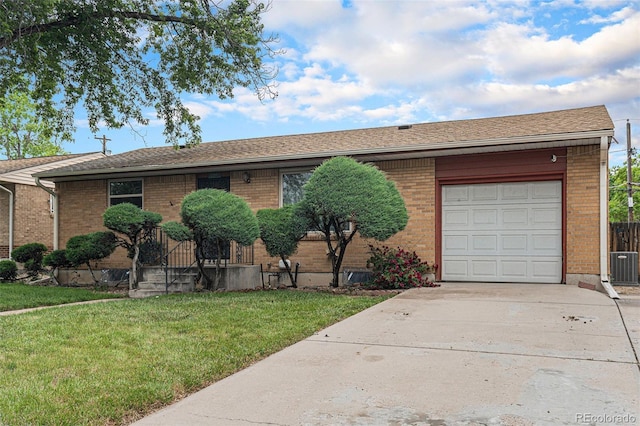 7644 Wyandot St, Denver, CO 80221 - ranch-style house featuring a garage, a front lawn, brick siding, and driveway