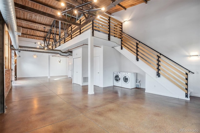 3033 Blake St Unit 121, Denver, CO 80205 - garage with washing machine and dryer and wooden ceiling