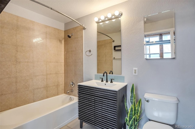 3033 Blake St Unit 121, Denver, CO 80205 - full bathroom with washtub / shower combination, vanity, and a textured wall