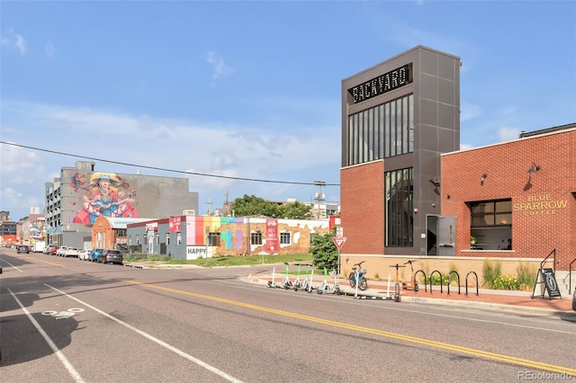 3033 Blake St Unit 121, Denver, CO 80205 - view of asphalt street with curbs, sidewalks, and street lights