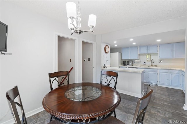 7172 S Vine Cir, Centennial, CO 80122 - dining area with a chandelier, a textured ceiling, baseboards, and recessed lighting