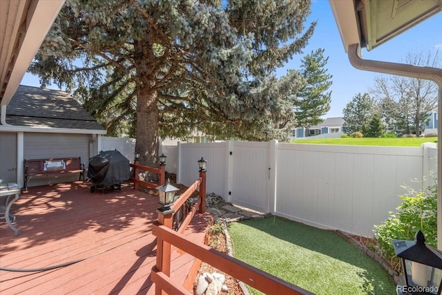7172 S Vine Cir, Centennial, CO 80122 - wooden deck featuring grilling area and a fenced backyard