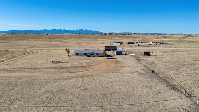 bird's eye view featuring a mountain view and a rural view