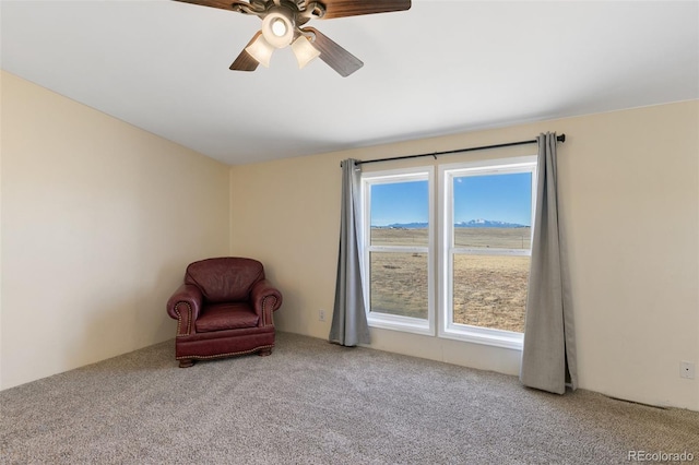 unfurnished room with carpet and ceiling fan