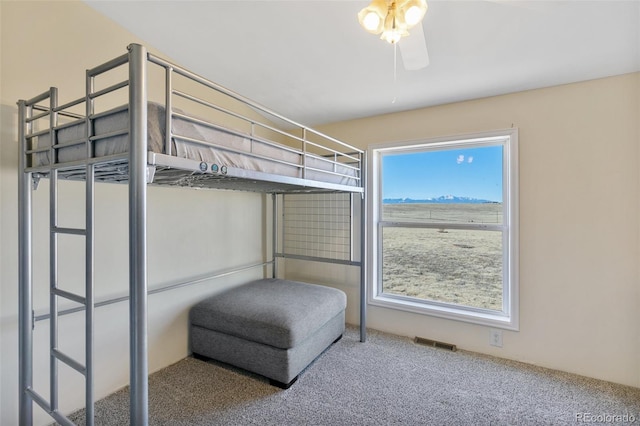 bedroom featuring ceiling fan and carpet floors