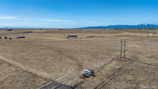 birds eye view of property with a mountain view and a rural view