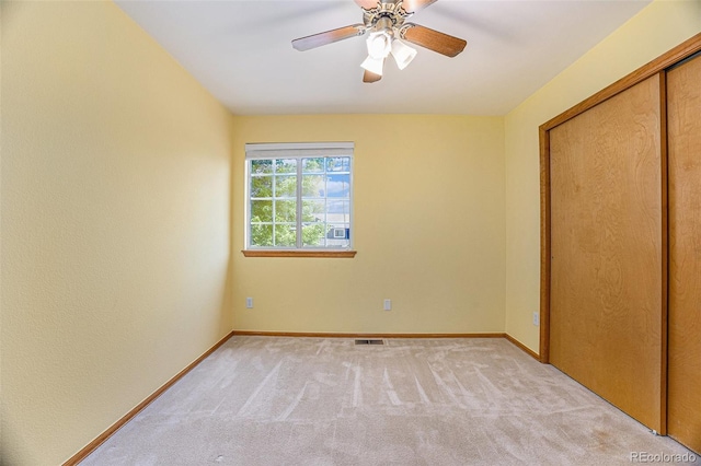9346 Lark Sparrow Dr, Highlands Ranch, CO 80126 - unfurnished bedroom with light carpet, baseboards, a closet, and a ceiling fan