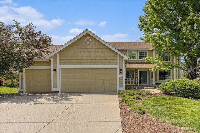 9346 Lark Sparrow Dr, Highlands Ranch, CO 80126 - view of front of house with an attached garage, driveway, a porch, and a shingled roof