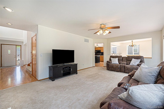 9346 Lark Sparrow Dr, Highlands Ranch, CO 80126 - living room featuring light colored carpet, a chandelier, baseboards, a ceiling fan, and recessed lighting