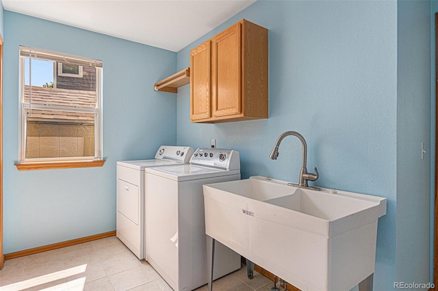 9346 Lark Sparrow Dr, Highlands Ranch, CO 80126 - laundry room featuring cabinet space, separate washer and dryer, baseboards, and light tile patterned floors