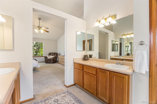 9346 Lark Sparrow Dr, Highlands Ranch, CO 80126 - full bathroom featuring vaulted ceiling, two vanities, a ceiling fan, and ensuite bath