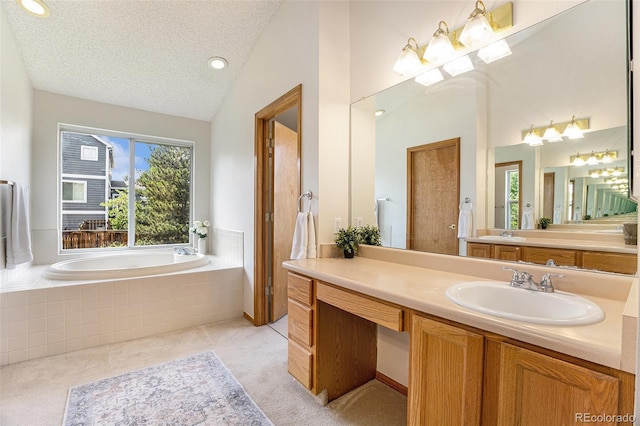 9346 Lark Sparrow Dr, Highlands Ranch, CO 80126 - bathroom featuring lofted ceiling, vanity, a garden tub, and a textured ceiling