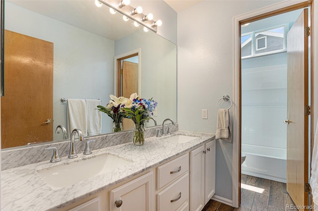 9346 Lark Sparrow Dr, Highlands Ranch, CO 80126 - bathroom featuring double vanity and baseboards