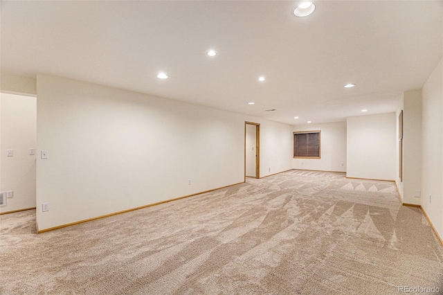 9346 Lark Sparrow Dr, Highlands Ranch, CO 80126 - empty room featuring light colored carpet, recessed lighting, and baseboards