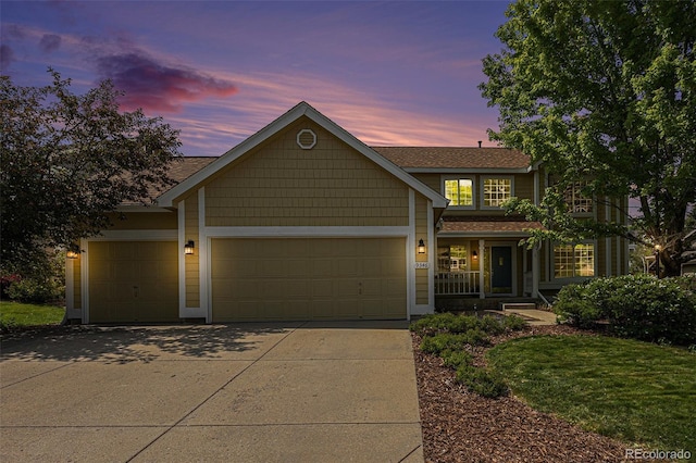 9346 Lark Sparrow Dr, Highlands Ranch, CO 80126 - view of front of home with an attached garage, driveway, and covered porch