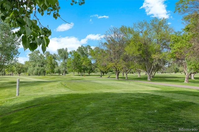 13824 E Lehigh Ave Unit B, Aurora, CO 80014 - view of home's community featuring a yard, view of wooded area, and view of golf course