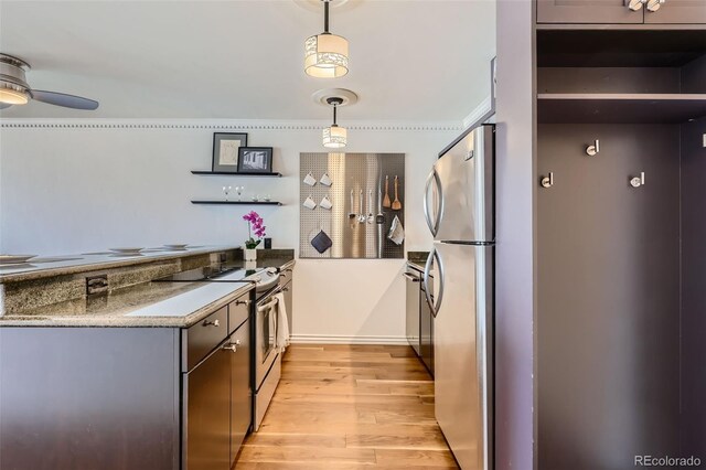 1050 N Corona St Unit 308, Denver, CO 80218 - kitchen featuring stainless steel appliances, light wood-style flooring, open shelves, a ceiling fan, and hanging light fixtures