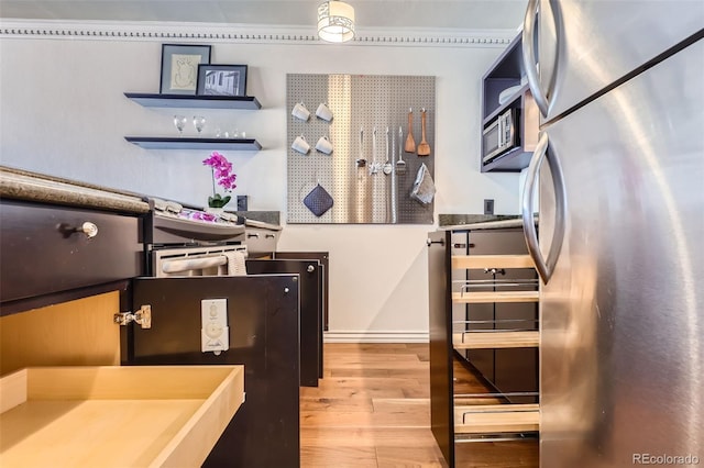 1050 N Corona St Unit 308, Denver, CO 80218 - kitchen featuring freestanding refrigerator and wood finished floors