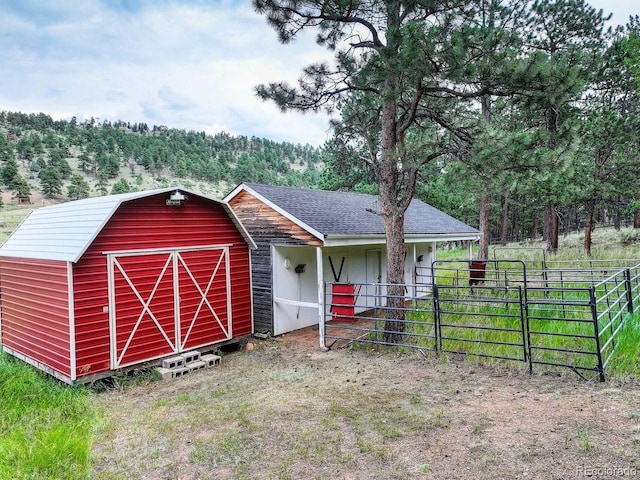 1539 Bluebird Dr, Bailey, CO 80421 - view of front facade featuring an outbuilding and a wooded view