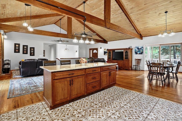 1539 Bluebird Dr, Bailey, CO 80421 - kitchen featuring open floor plan, a wooden ceiling with exposed beams, ceiling fan, light wood-style flooring, and pendant lighting
