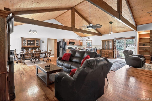 1539 Bluebird Dr, Bailey, CO 80421 - living room with a chandelier, a wood ceiling with exposed beams, ceiling fan, hardwood / wood-style flooring, and high vaulted ceiling