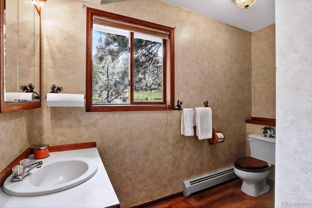 1539 Bluebird Dr, Bailey, CO 80421 - bathroom with a baseboard radiator, vanity, and wood finished floors