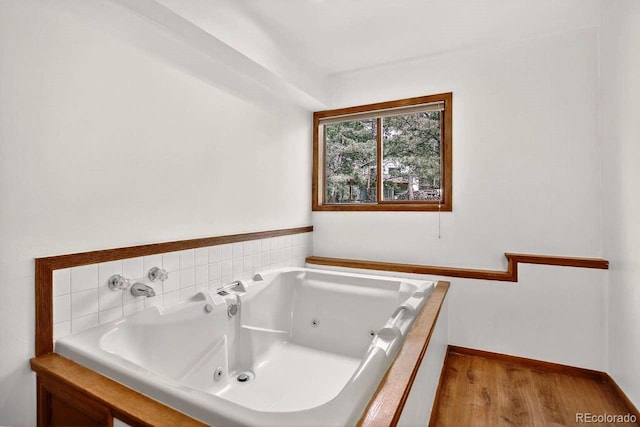 1539 Bluebird Dr, Bailey, CO 80421 - full bath with a tub with jets and wood finished floors