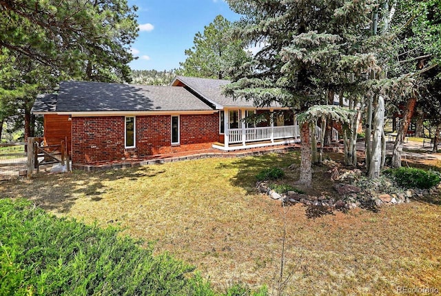 1539 Bluebird Dr, Bailey, CO 80421 - back of property featuring brick siding and a shingled roof