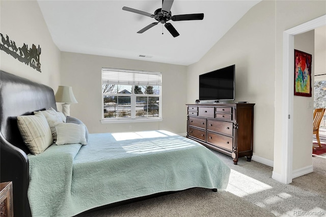 bedroom featuring visible vents, baseboards, a ceiling fan, vaulted ceiling, and carpet flooring