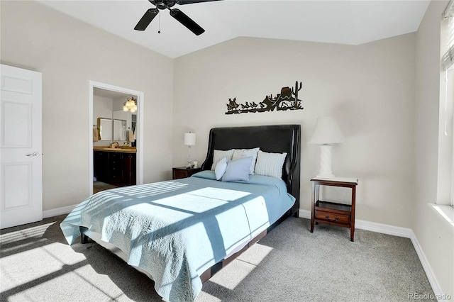 bedroom featuring lofted ceiling, carpet flooring, connected bathroom, and baseboards